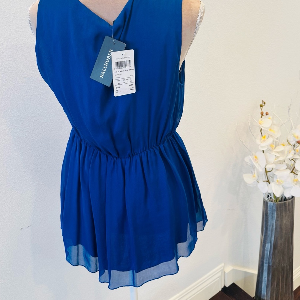 Brand new silk sleeveless shirt, and deep blue. Purchased in Europe, size 42